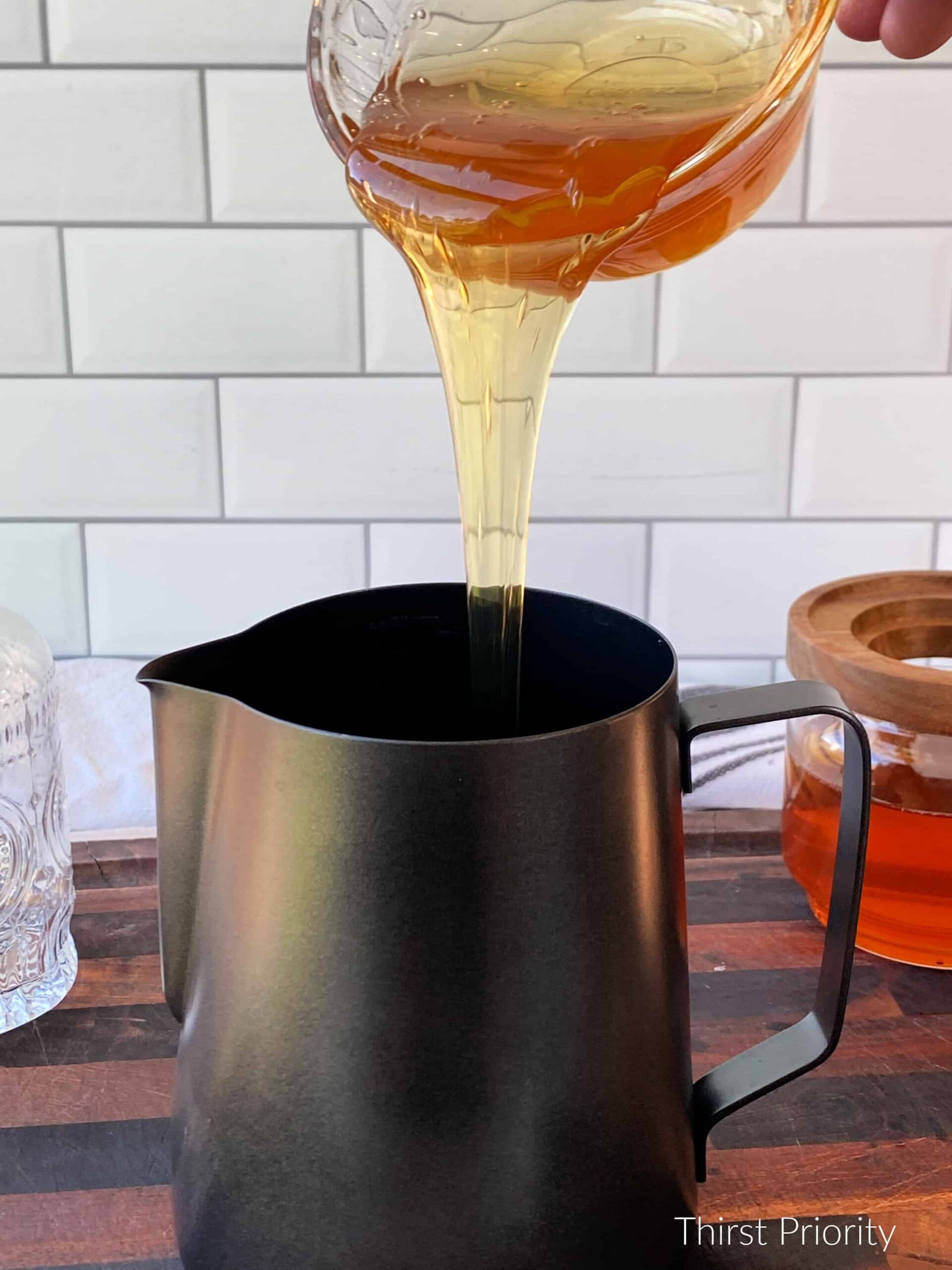 pour local honey into saucepan