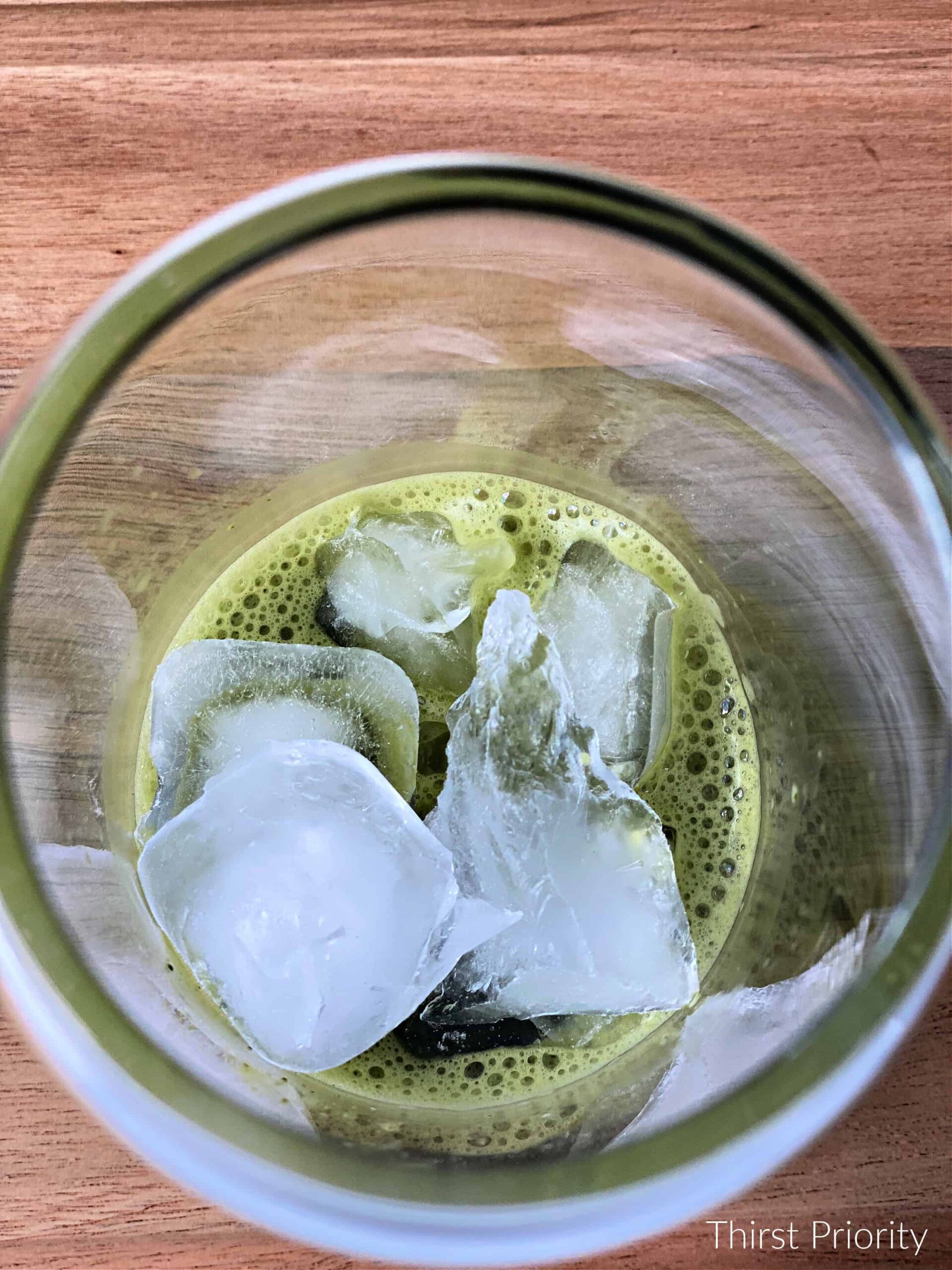 ice in glass with whisked matcha