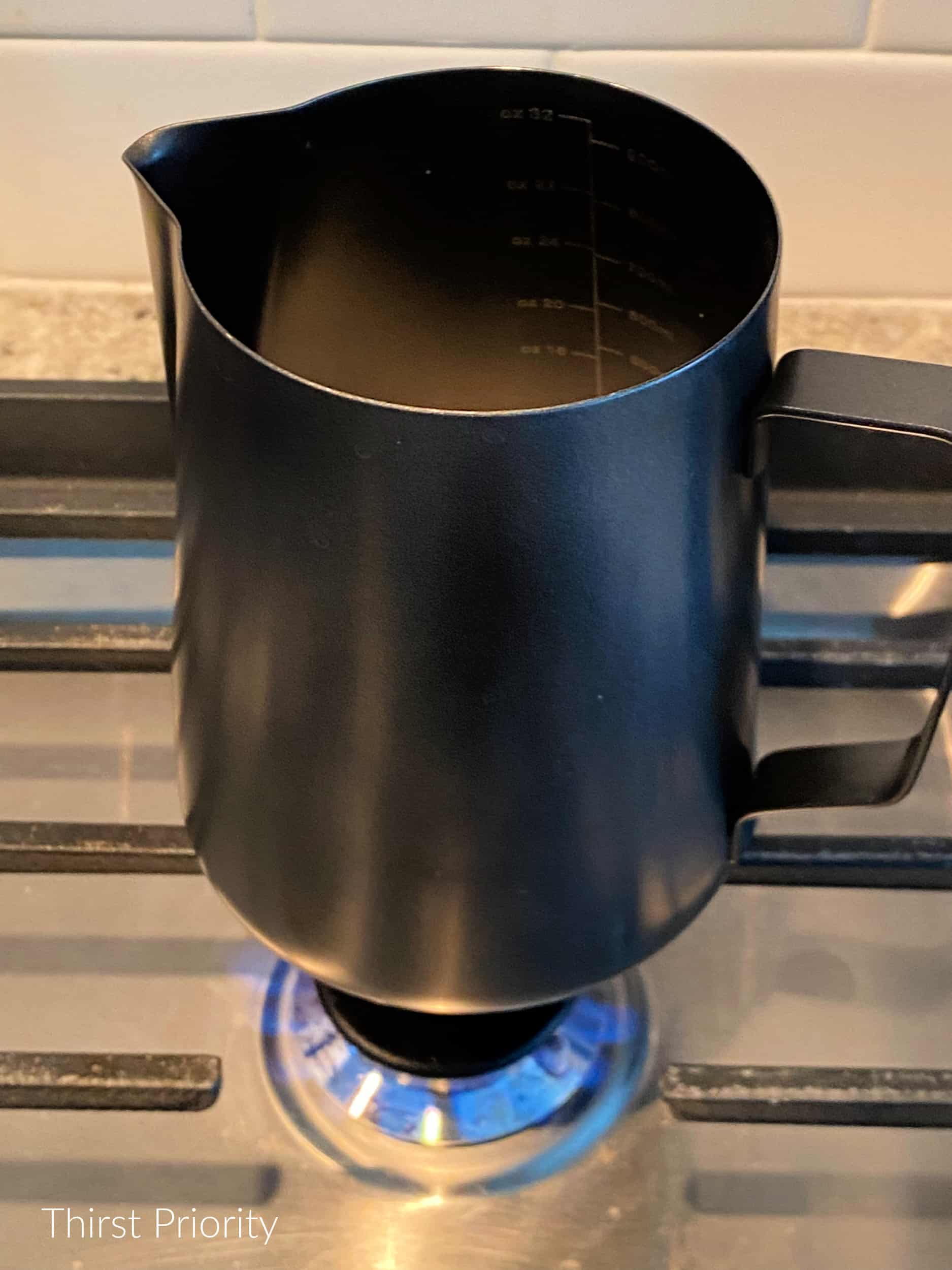heat milk and cacao on stove 
