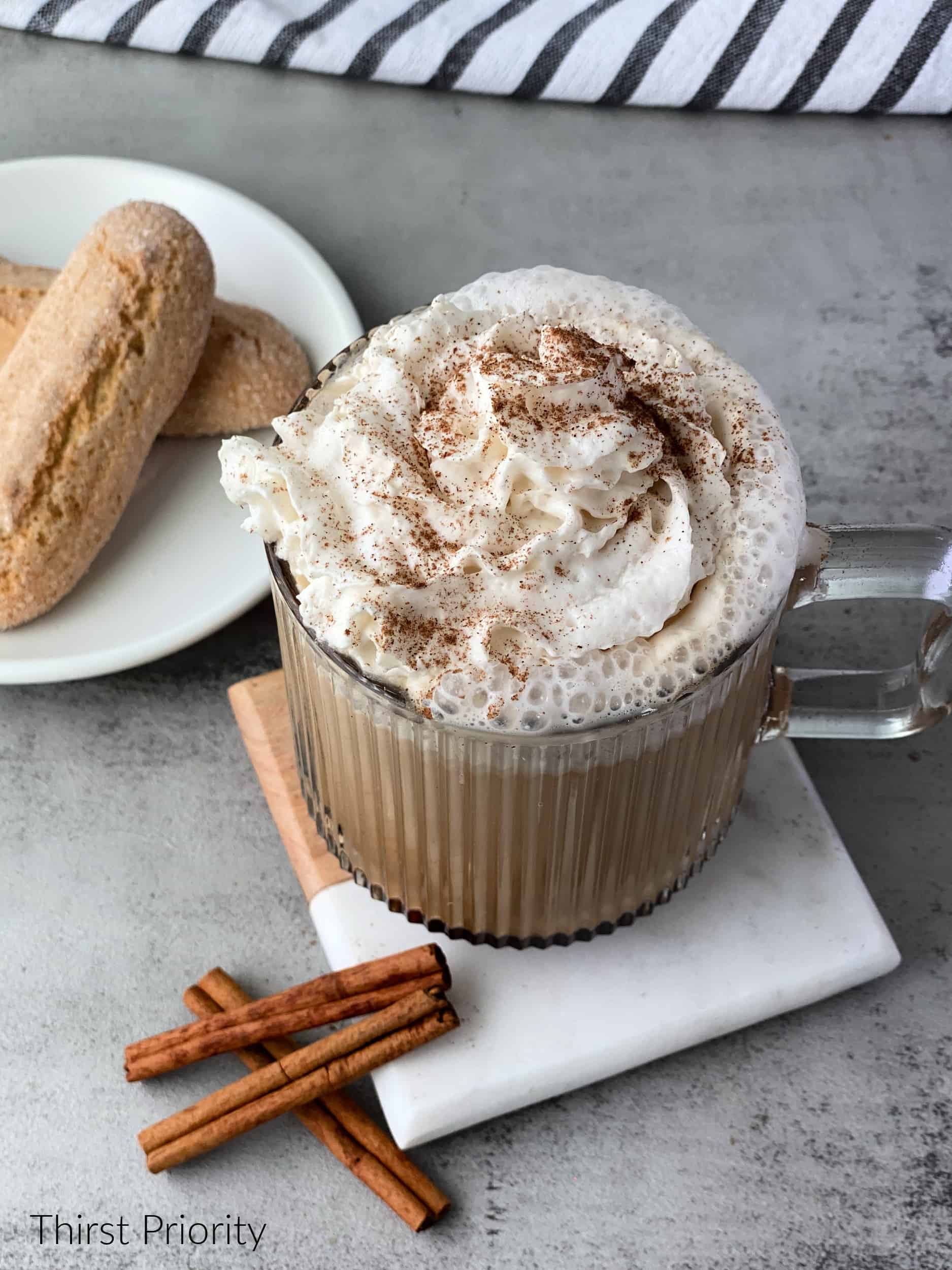 Cinnamon Dolce Latte Recipe topped with whipped cream and cinnamon